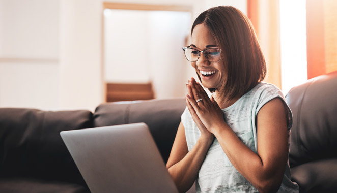 Happy women using laptop - renters Insurance in 3 easy steps